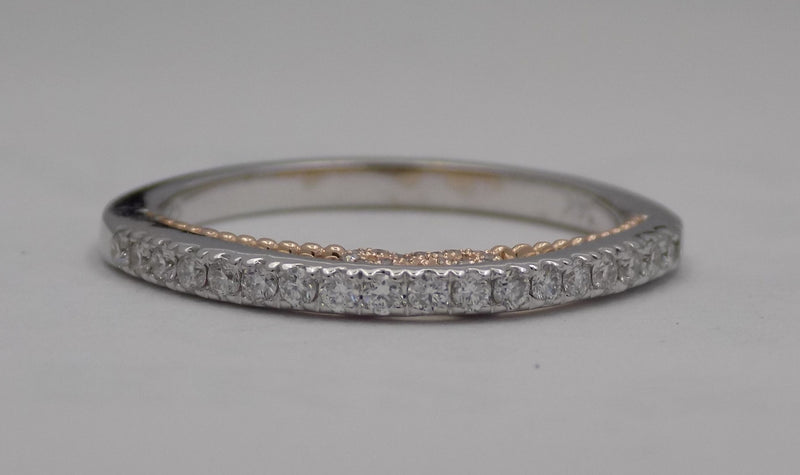14 karat two-tone, white and rose gold diamond wedding band with infinity design, top view.