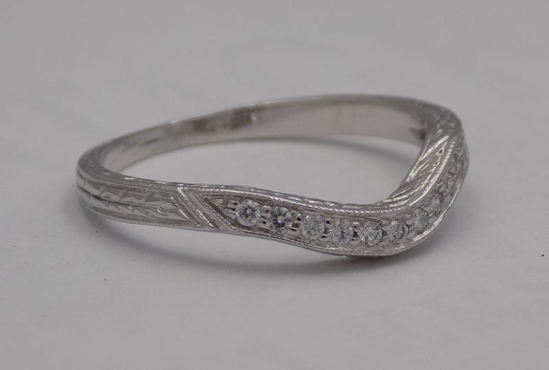 White gold filigree diamond wedding set.