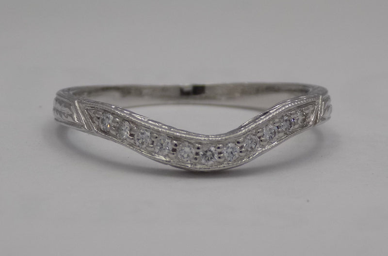 White gold filigree diamond wedding set.