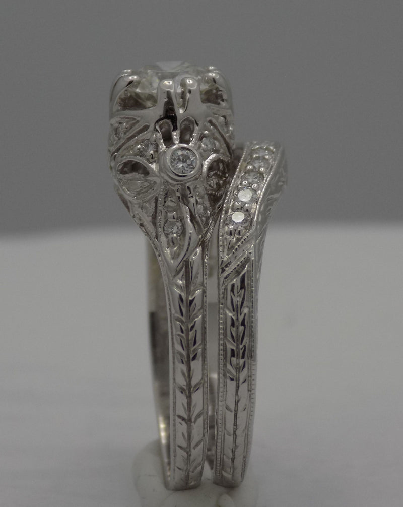 White gold filigree diamond wedding set.