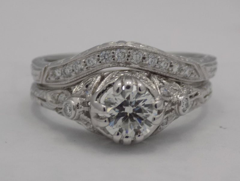 White gold filigree diamond wedding set.