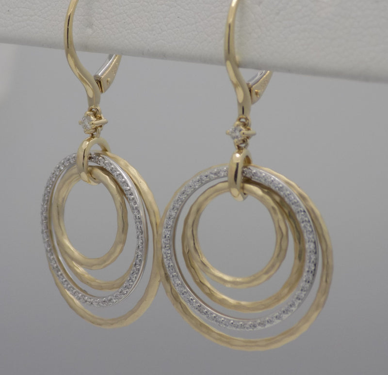 Two tone diamond stacked circle drop earrings.