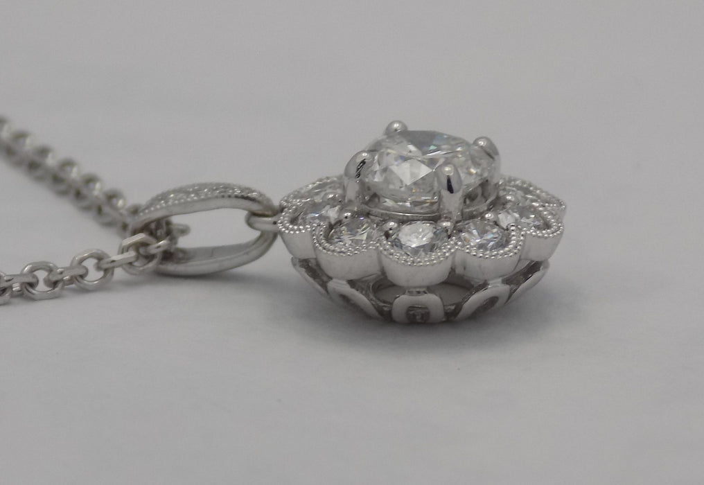 White gold halo style diamond pendant.