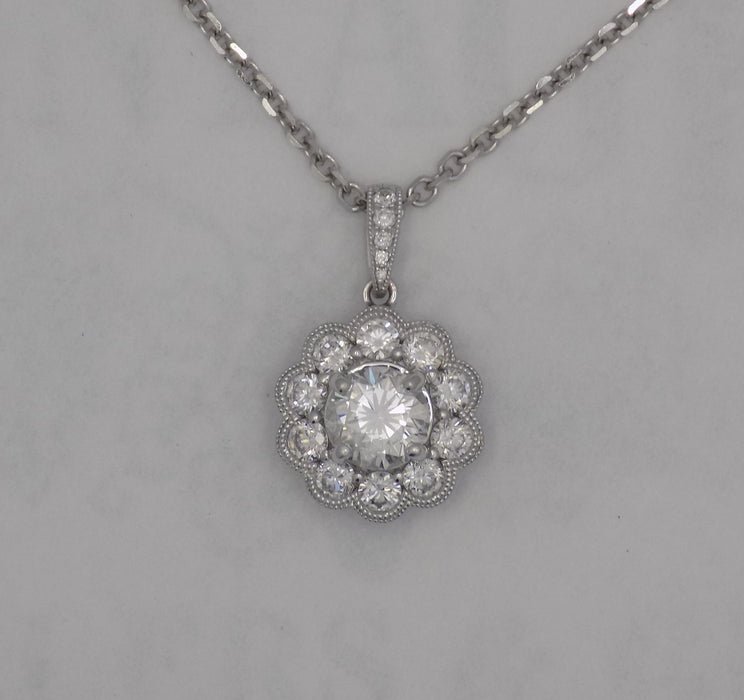 White gold halo style diamond pendant.