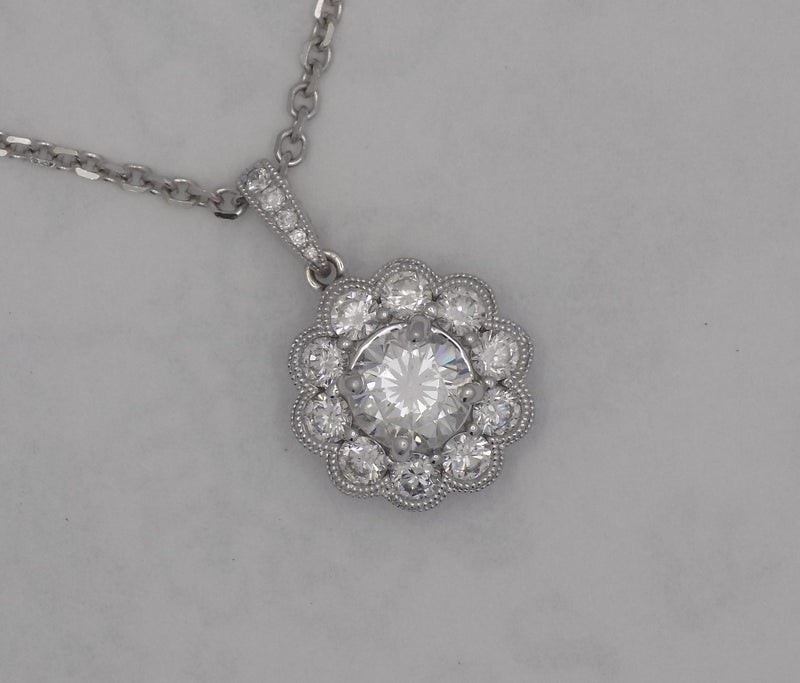 White gold halo style diamond pendant.