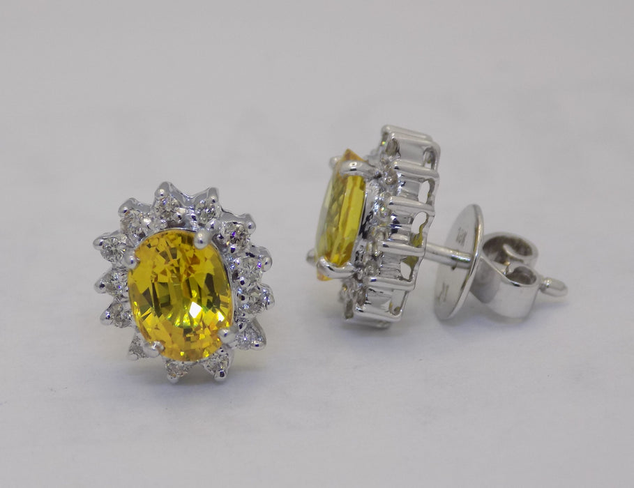 White gold golden sapphire diamond halo earrings.