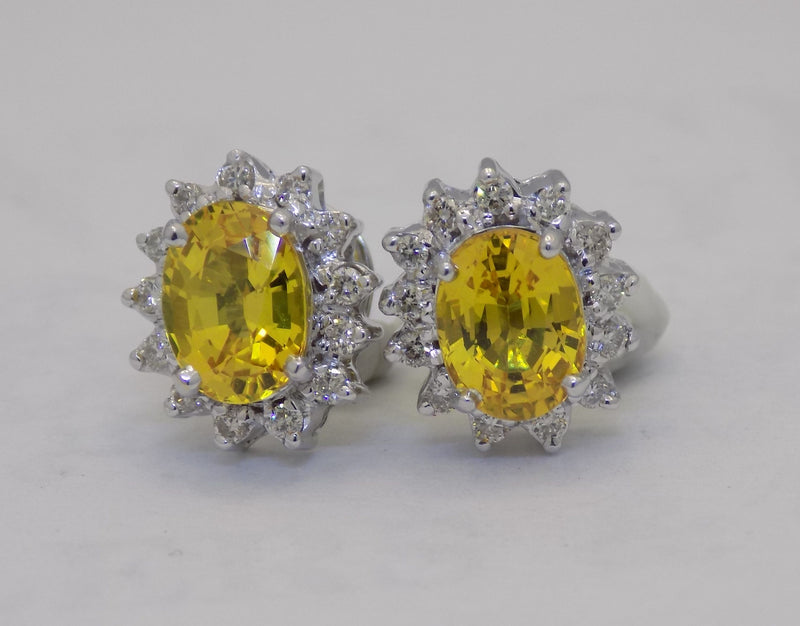 White gold golden sapphire diamond halo earrings.