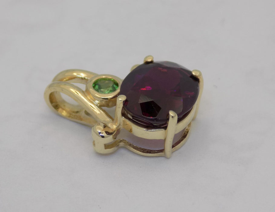 Garnet pendant with bezel set tsavorite garnet in 14k gold
