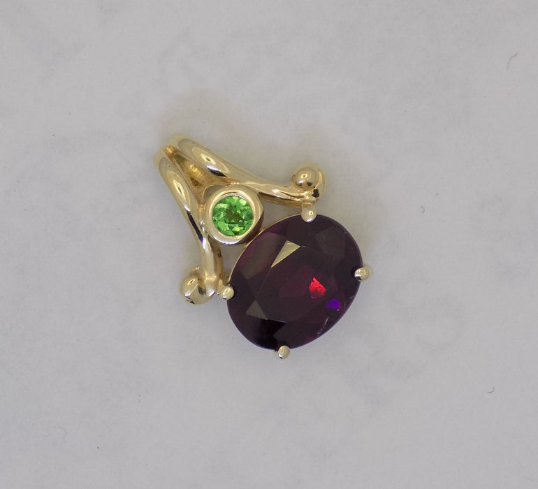 Garnet pendant with bezel set tsavorite garnet in 14k gold