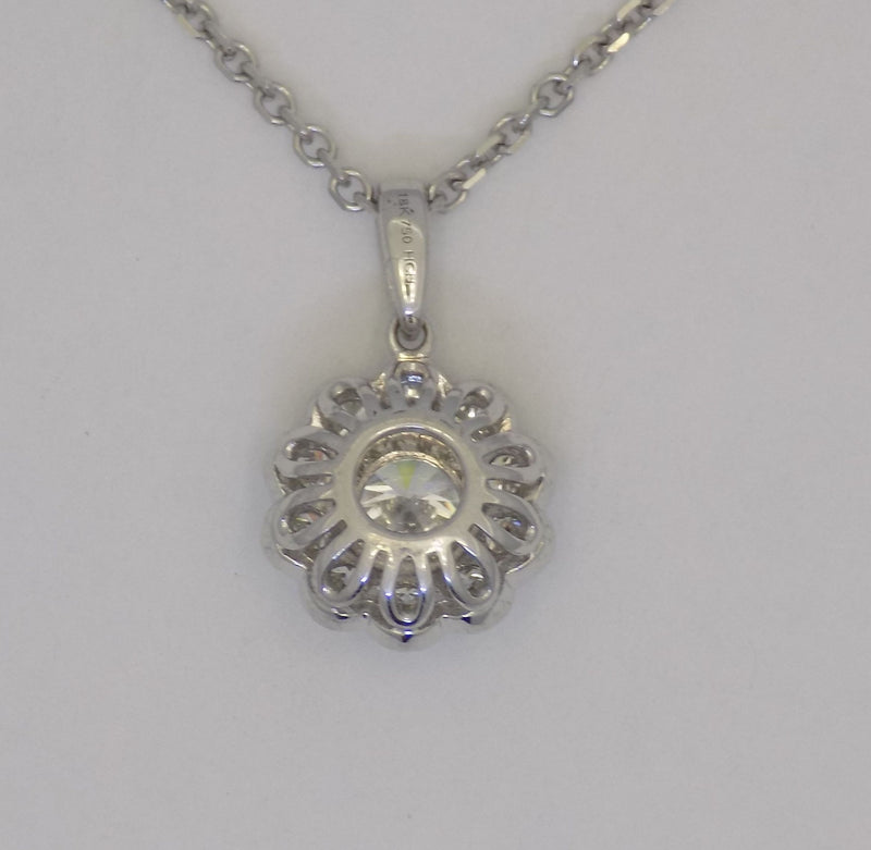 White gold halo style diamond pendant.