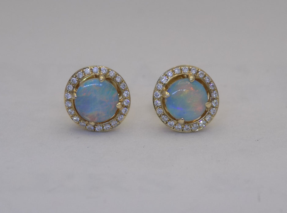 Yellow gold halo diamond with round crystal opal earrings.
