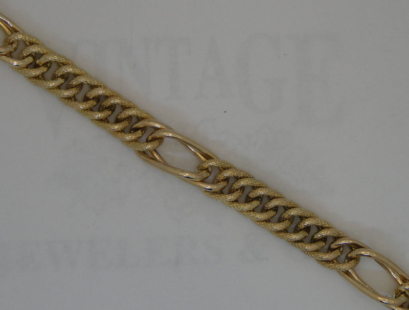 Yellow gold 7.5" link bracelet.
