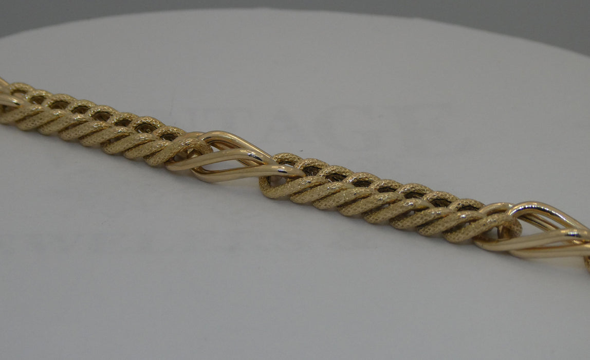 Yellow gold 7.5" link bracelet.