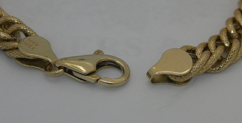 Yellow gold 7.5" link bracelet.