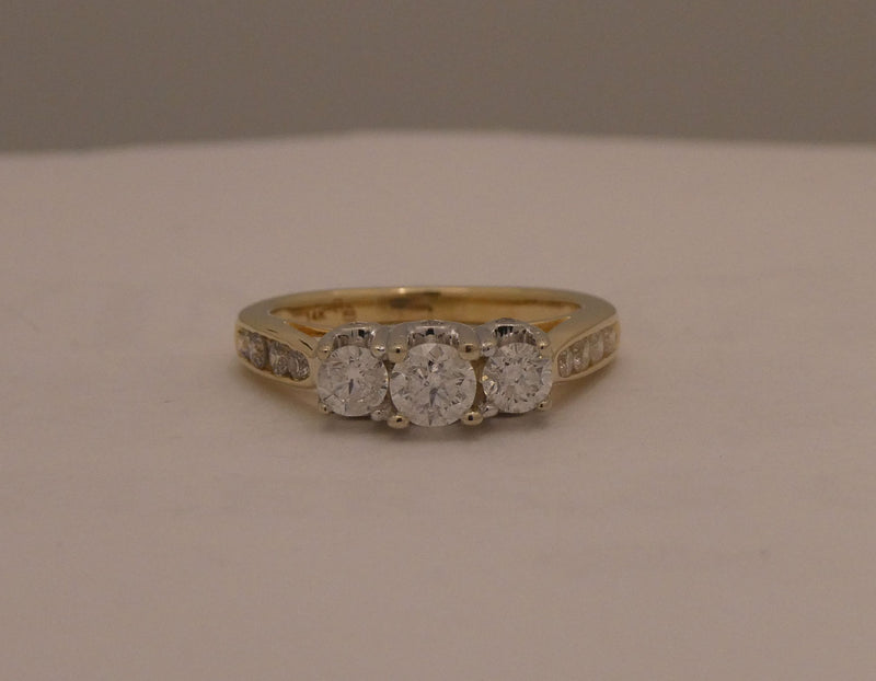 Two-tone 3 stone style diamond ring