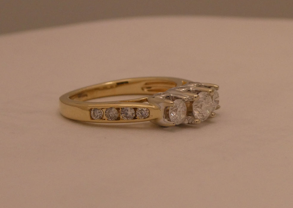 Two-tone 3 stone style diamond ring