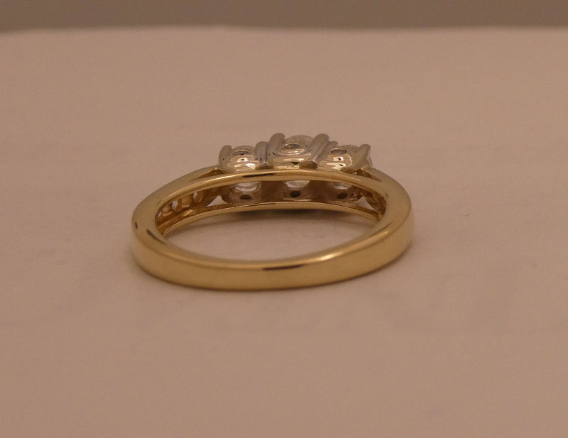 Two-tone 3 stone style diamond ring