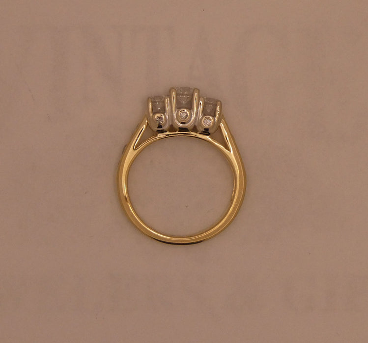 Two-tone 3 stone style diamond ring