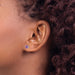 14 karat white gold 5 mm round amethyst stud pierced earrings on model