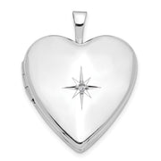 14 karat white gold heart shaped hinged locket with a .01 carat diamond in the center.