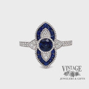 Revolving video of 14 karat white gold .63 carat total weight natural blue sapphire and diamond ring