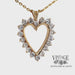 Revolving video of 14 karat yellow gold 2ctw diamond heart shaped pendant