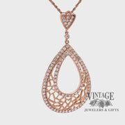Revolving video of 18 karat rose gold 1.29 carat total weight diamond pear shape pendant
