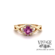 Revolving video of custom 14 karat yellow gold pink sapphire with diamond halo ring
