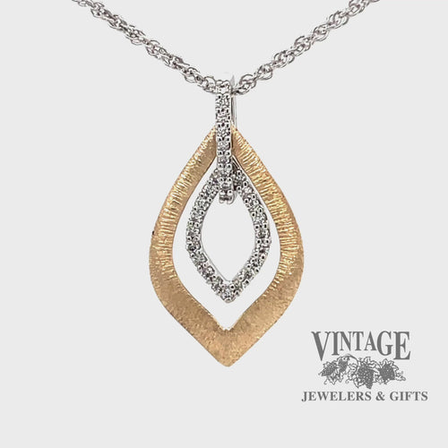 Revolving video of 14 karat two tone diamond leaf shape necklace