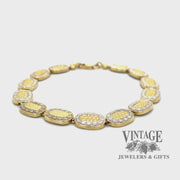 Two tone oval link embossed 14k gold 7.5" bracelet video