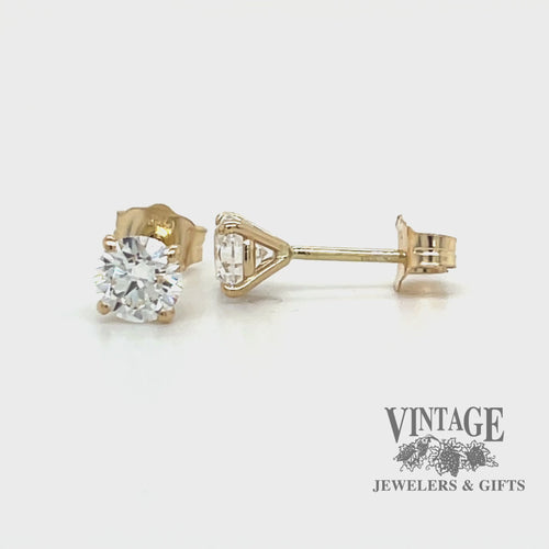 Revolving video of 14 karat yellow gold .80 carat total weight round lab grown diamond stud pierced earrings