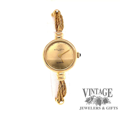 Revolving video of Estate 14 karat yellow gold ladies Baume & Mercier watch with chain bracelet