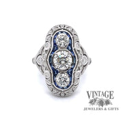 Revolving video of 14k white gold vintage inspired filigree 3-stone diamond and sapphire ring