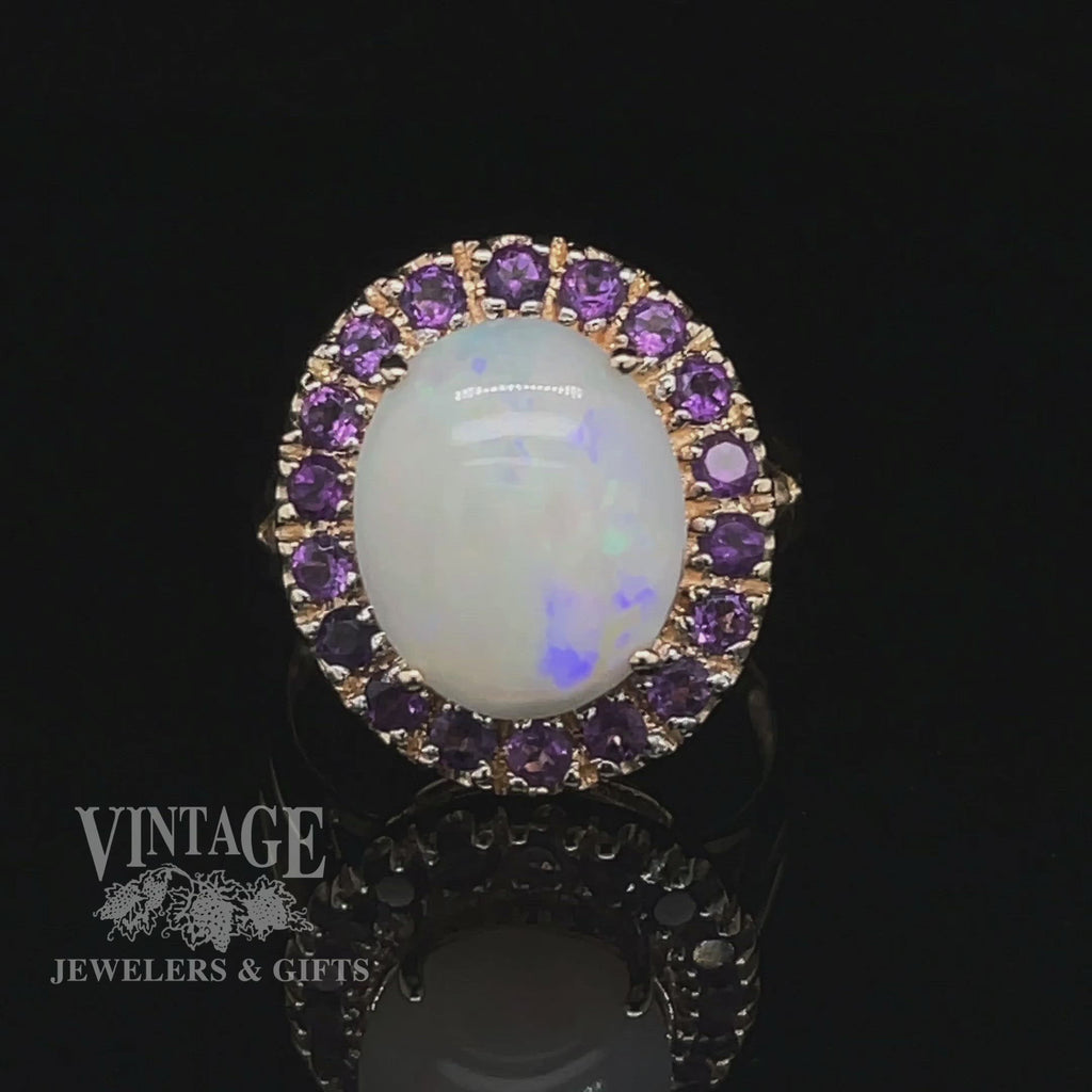 Revolving video of 10 karat yellow gold white opal and amethyst halo ring
