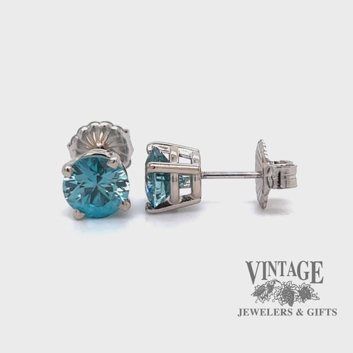 Revolving video of 14 karat white gold 6 carat total weight round blue Zircon stud earrings