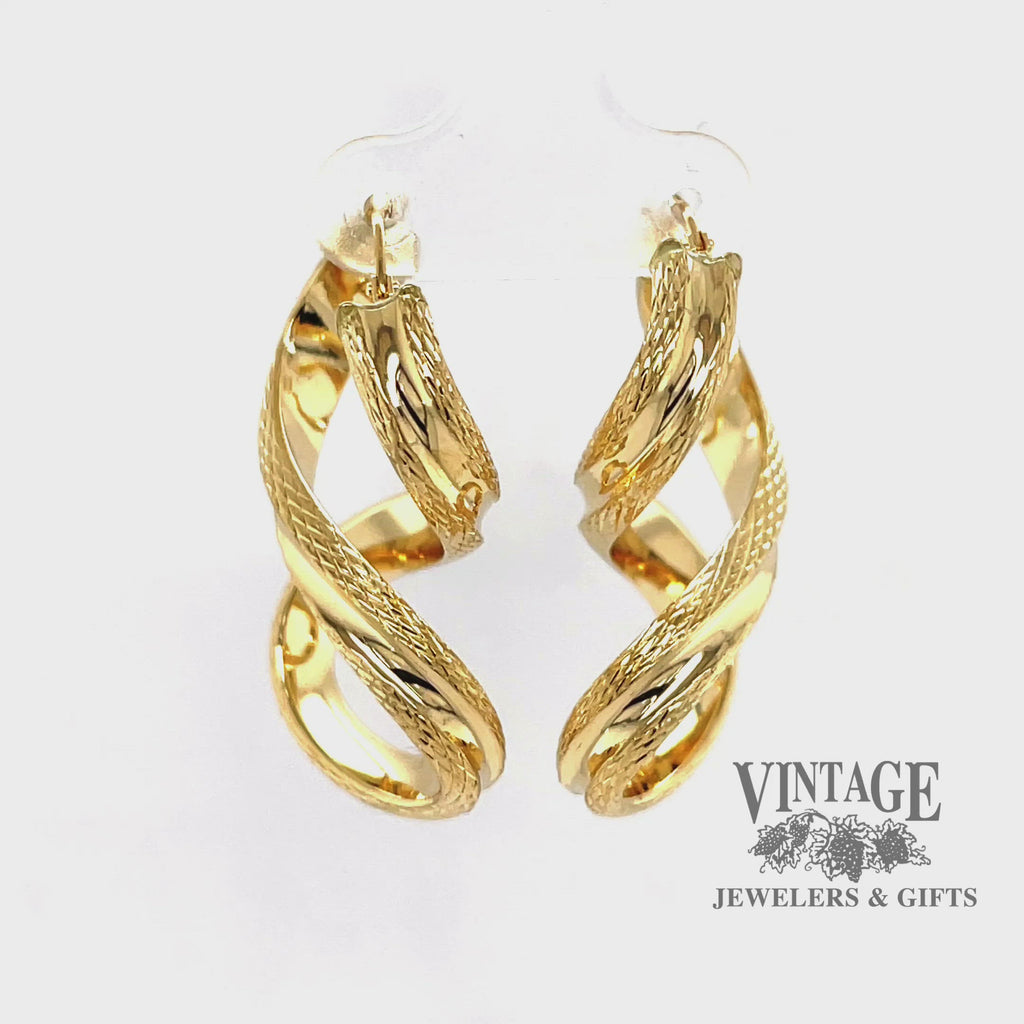 Revolving video of Twisted 18k gold textured hoop earrings
