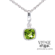 Revolving video of 14 karat white gold checkerboard cushion cut natural peridot pendant
