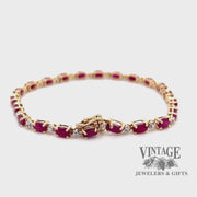Revolving video of 14 karat yellow gold ruby and diamond tennis bracelet