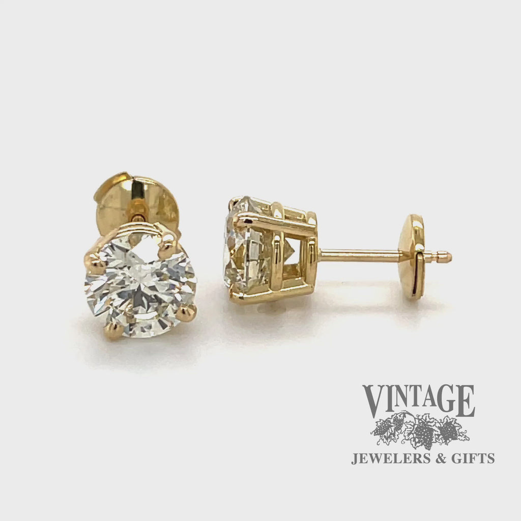 Revolving video of 18 karat gold 3.27 carat total weight Diamond stud earrings
