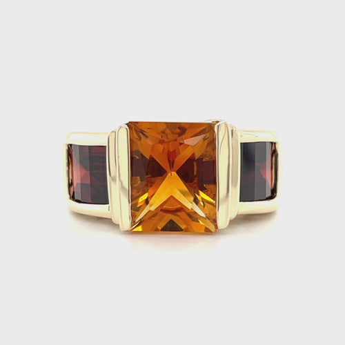 Revolving video of 14 karat yellow gold Starburst cut citrine and pyrope garnet stone ring