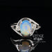 Crystal opal ring in white gold with diamonds top