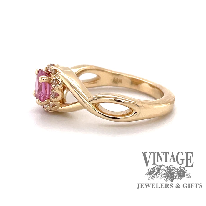 Custom 14 karat yellow gold pink sapphire with diamond halo ring, side view