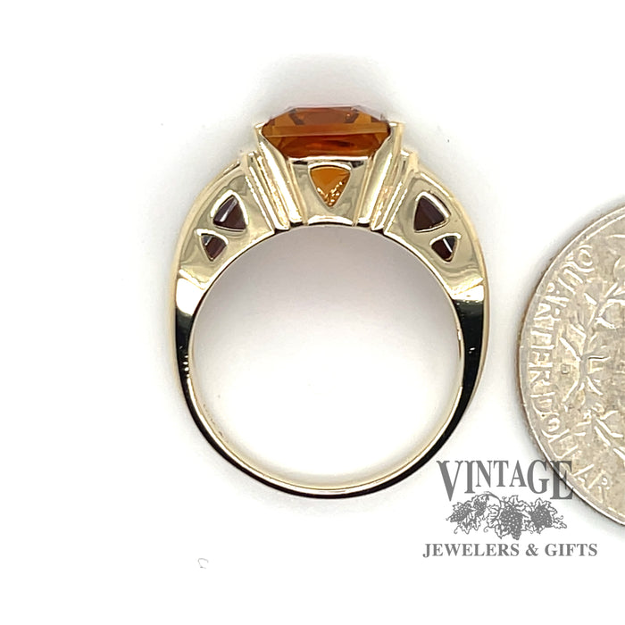 14 karat yellow gold Starburst cut citrine and pyrope garnet stone ring, side through finger with quarter for size reference