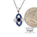 14 karat white gold natural blue sapphire and diamond necklace, shown with quarter for size reference