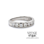 18 karat white gold channel set diamond band, angled