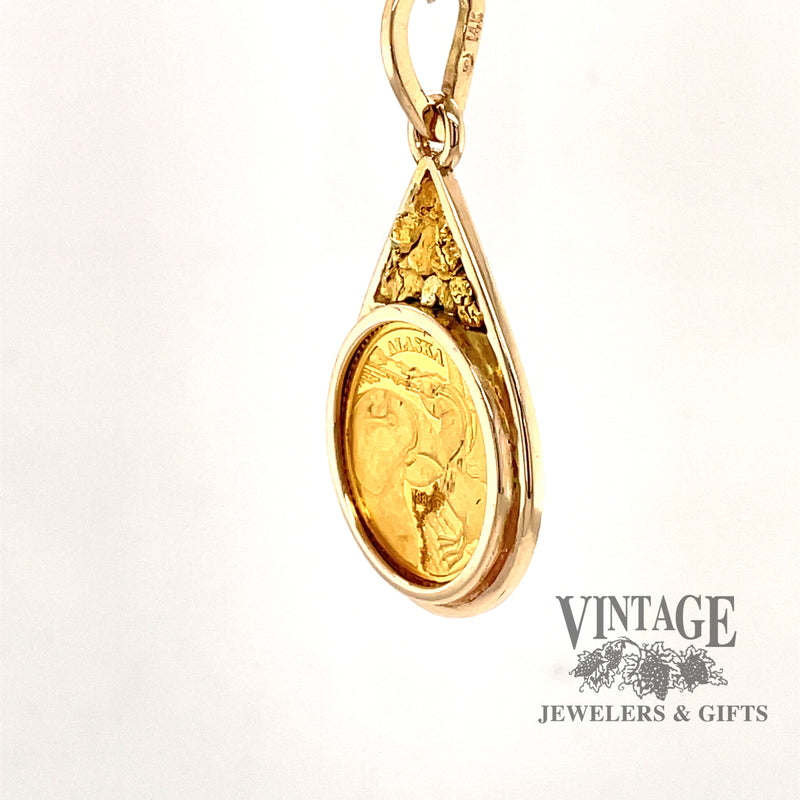 14 karat yellow gold estate state of Alaska 1/10 oz commemorative coin pendant, angled view