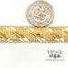 14 karat yellow gold estate omega link bracelet next to quarter for scale