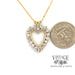 14 karat yellow gold 2ctw diamond heart shaped pendant, shown with quarter for size reference