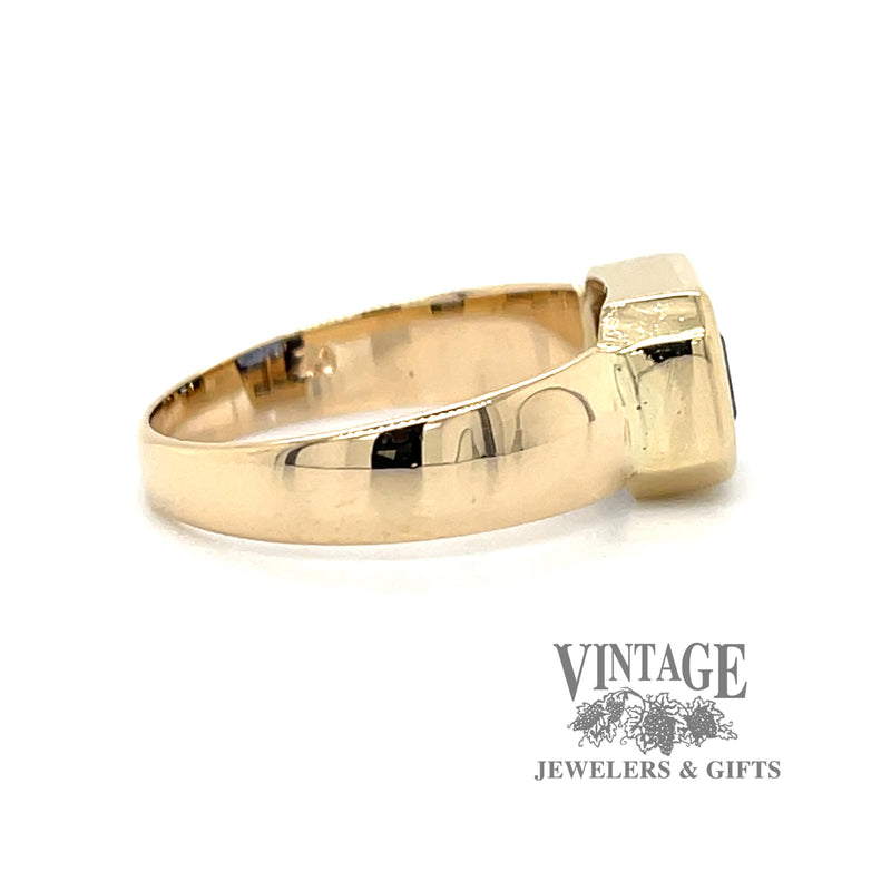 Emerald cut blue cubic zirconia in 14ky gold ring side