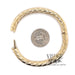 14 karat yellow gold twisted design, hinged bangle bracelet, shown with quarter for size reference